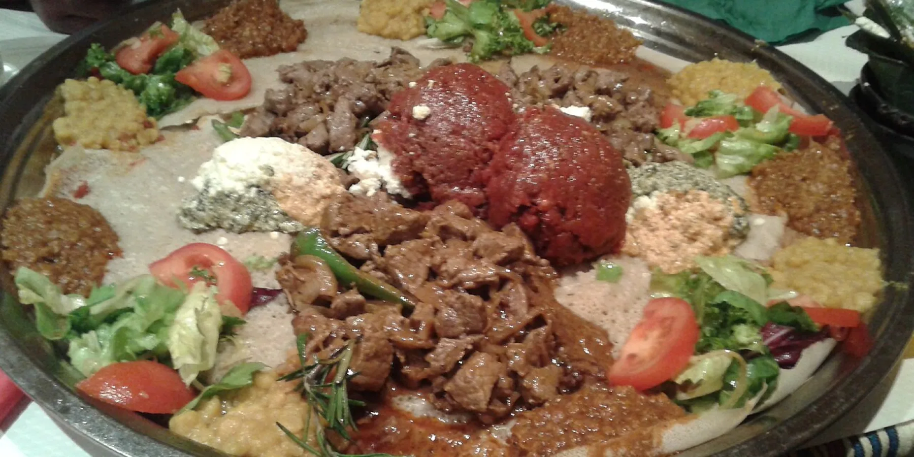 Restaurant table with Ethiopian dishes